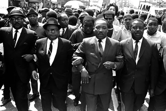 After King led a protest where violence broke out, he insisted: “We must not overlook the conditions that led up to yesterday.” Jack Thornell / AP Images