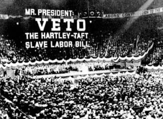 A sign at a 1947 union rally at Madison Square Garden calling on President Harry Truman to veto the Taft-Hartley labor bill.